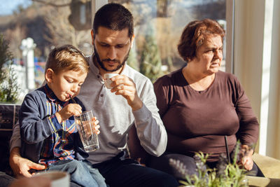 Multi-generational family having fun in yard