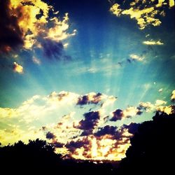 Scenic view of landscape against cloudy sky