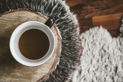 High angle view of coffee cup on table