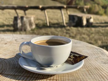 Close-up of coffee cup on table