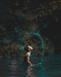 Side view of woman swimming in sea