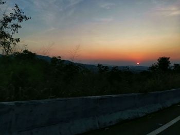 Scenic view of silhouette landscape against sky during sunset