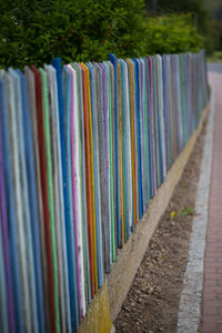 Close-up of multi colored pencils on footpath