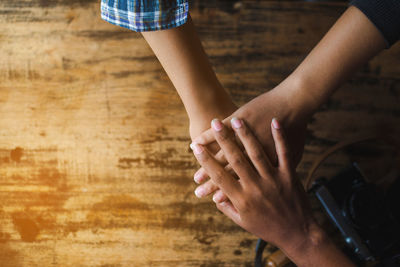 Cropped hands of business people doing hand stack in office