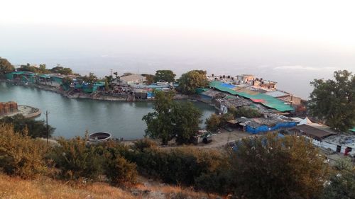 Panoramic view of people on beach against sky