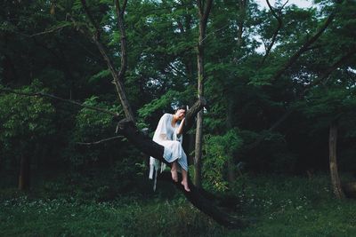 Full length side view of man in forest