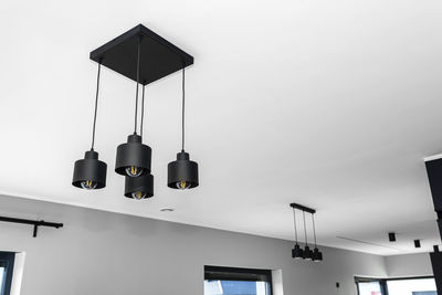 Modern chandeliers with tube shaped led bulbs, covered with matt black paint, four and three bulbs