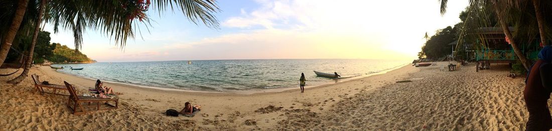 Scenic view of beach at sunset