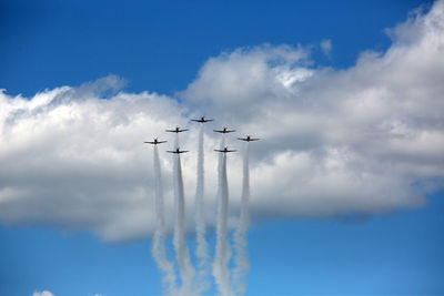 Low angle view of airplane flying in sky