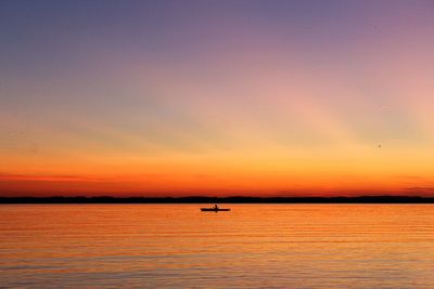 Scenic view of sea against romantic sky at sunset