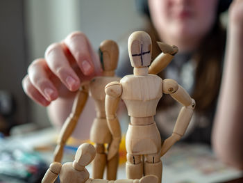 Close-up of hand holding figurine