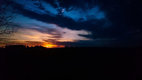 Scenic view of silhouette landscape against sky at sunset