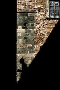 Shadow of woman on wall