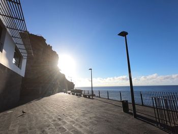 Street amidst buildings against sky