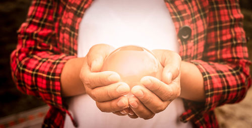 Close-up of woman holding hands