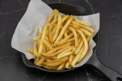 High angle view of burger and fries on table