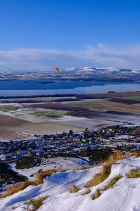 Scenic view of lake against sky during winter
