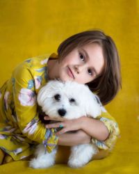 Portrait of cute girl with dog