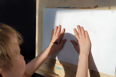 High angle view of woman holding hands