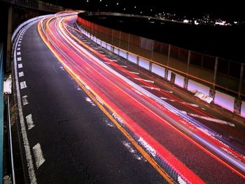 High angle view of light trails on road at night