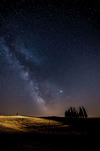 Scenic view of field against sky at night