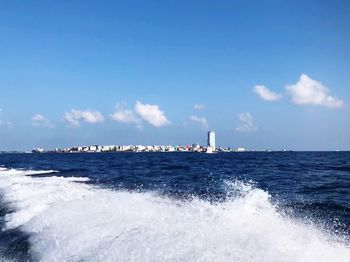 Sailboat in sea against sky