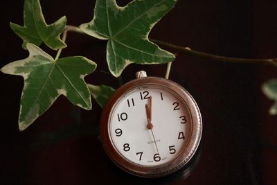 Close-up of clock on table