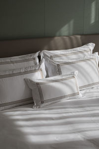 Close-up of empty chair on bed at home