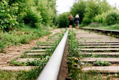 Girls go together by railway