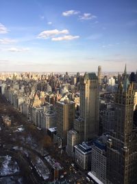 High angle view of modern buildings in city against sky