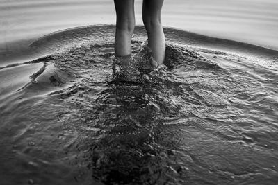 Low section of woman on beach