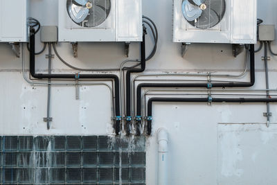 Close-up of pipes against wall