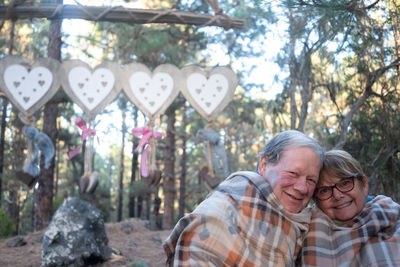 Portrait of senior couple at forest