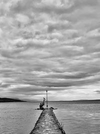 Pier over sea against sky