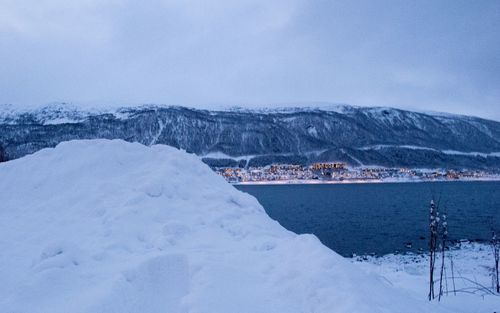 Scenic view of snow covered mountains against sky