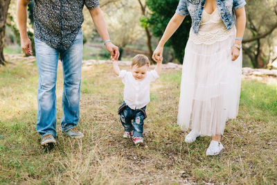 Women walking with daughter on plants