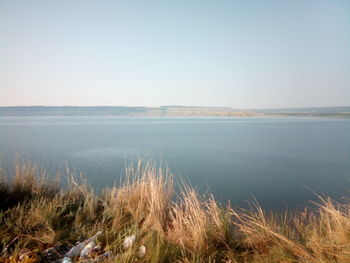 Scenic view of sea against clear sky