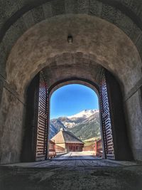 Buildings seen through arch window