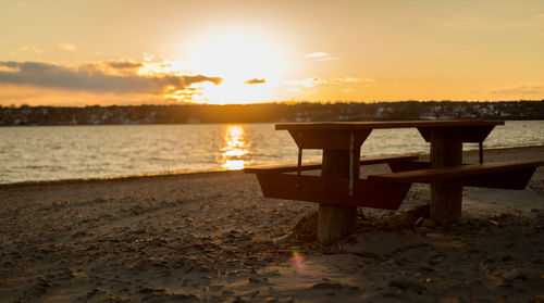 Scenic view of beach against sky during sunset