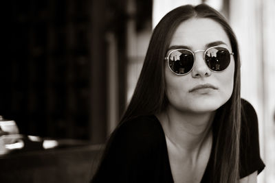 Portrait of young woman wearing sunglasses