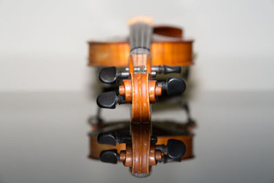 Close-up of coin on table against white background