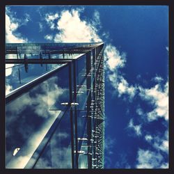 Low angle view of building against cloudy sky