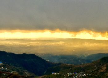 Scenic view of landscape against sky during sunset