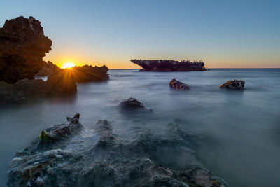 Scenic view of sea against sky during sunset