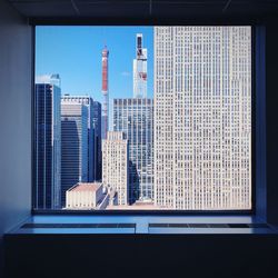 Modern buildings seen through glass window
