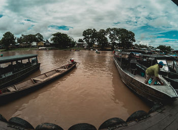 People on boat against sky