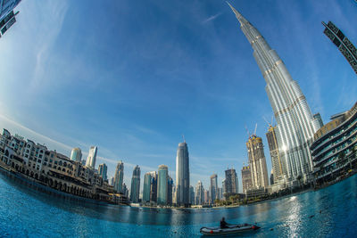 Modern buildings in city against sky