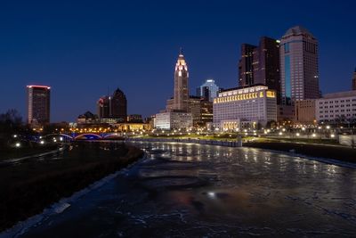 Illuminated buildings in city at night