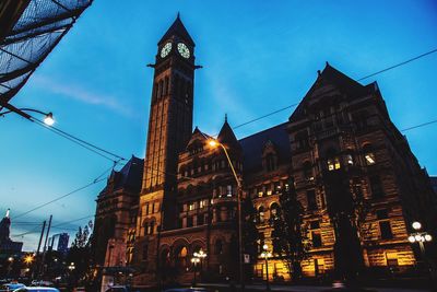 Low angle view of illuminated buildings at night