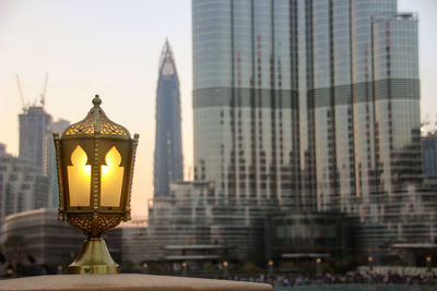 Illuminated city against sky